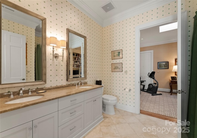 bathroom with tile patterned flooring, vanity, ornamental molding, and toilet