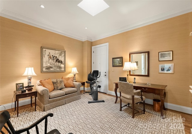 office space featuring a skylight, ornamental molding, and light hardwood / wood-style floors