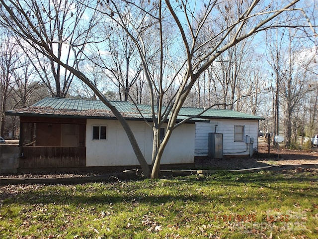 rear view of house with a lawn