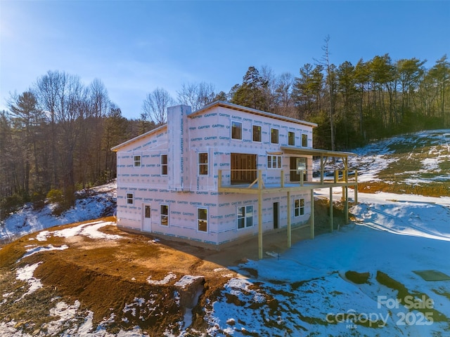 view of snow covered house