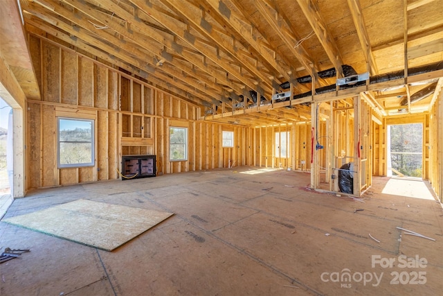 misc room with a towering ceiling