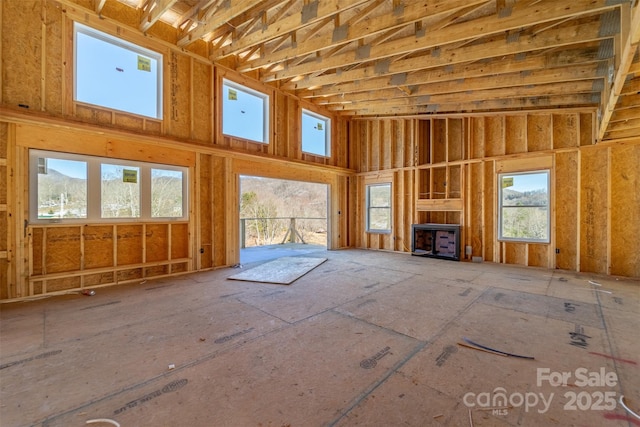 unfurnished living room with a high ceiling