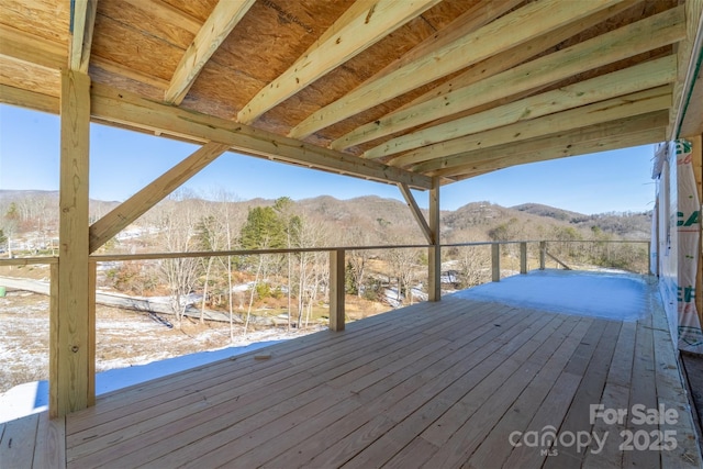 wooden deck with a mountain view