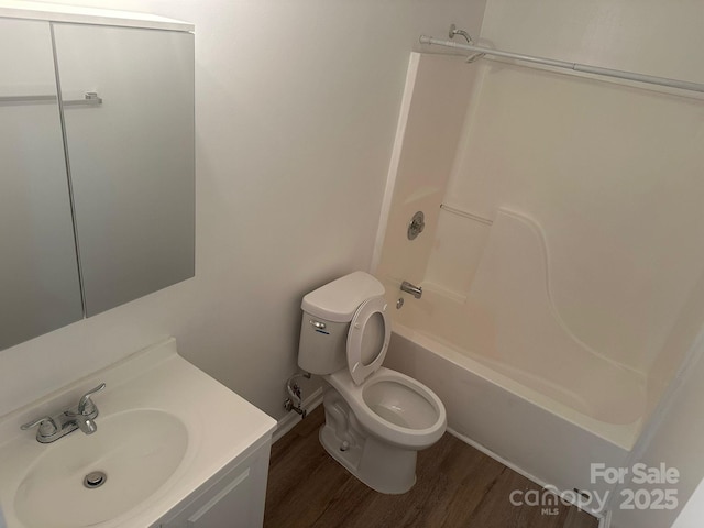 full bathroom featuring shower / bathtub combination, wood-type flooring, toilet, and vanity