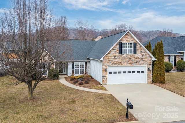 view of front of property featuring a garage and a front yard