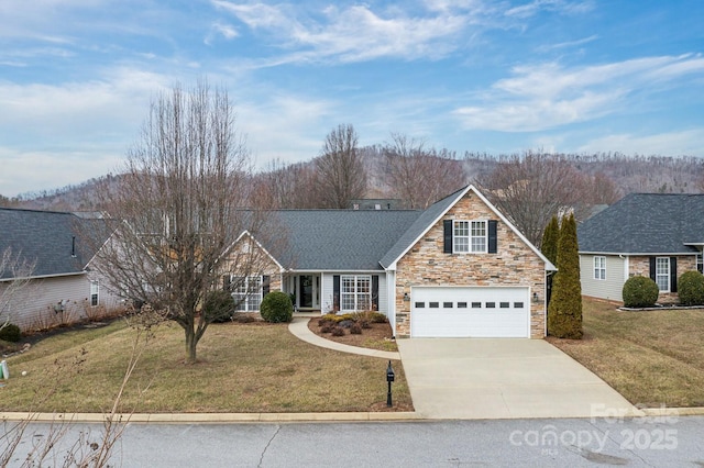 view of front of house featuring a garage and a front yard