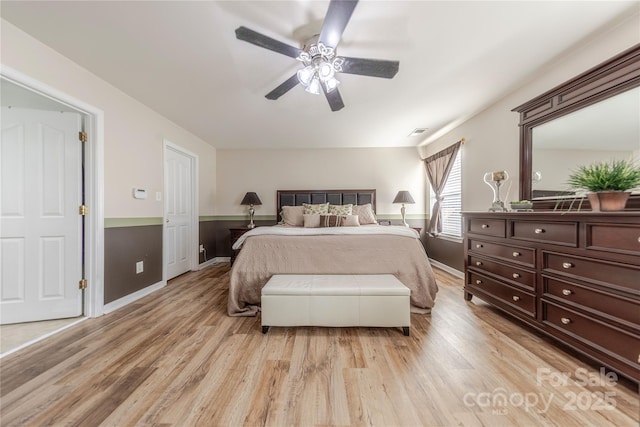 bedroom featuring ceiling fan and light hardwood / wood-style floors