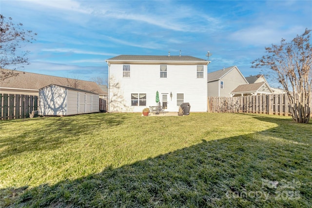 back of house featuring a yard, a patio area, and a storage unit