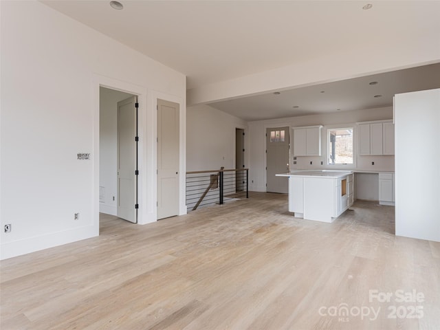 unfurnished living room with light hardwood / wood-style floors