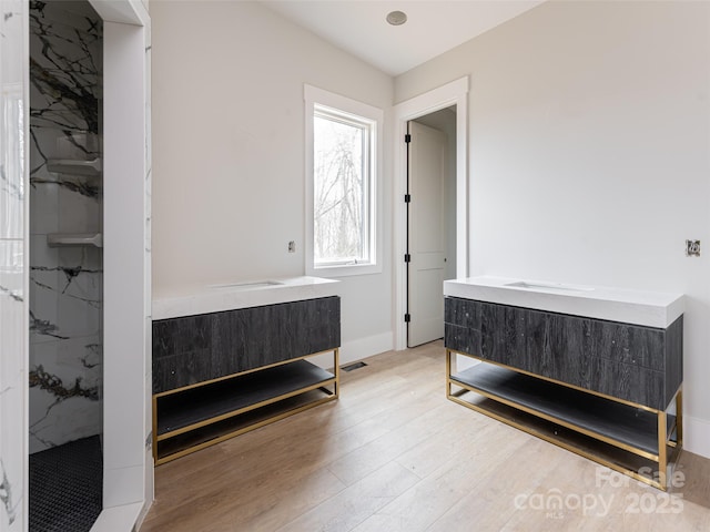 bedroom featuring light hardwood / wood-style floors and a closet