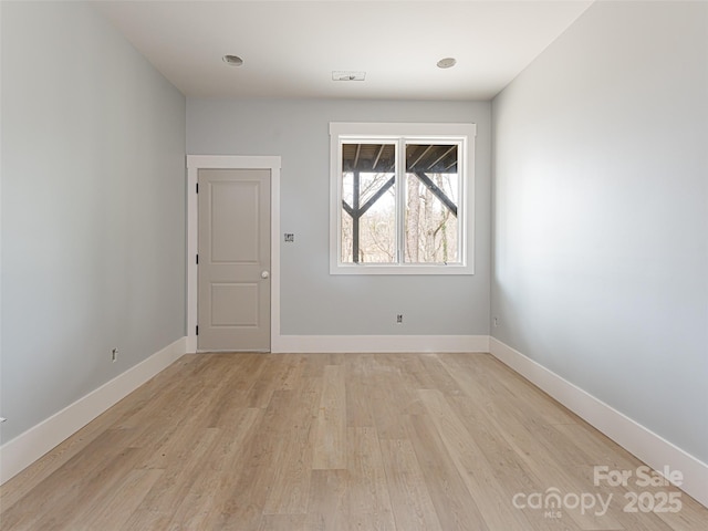 unfurnished room featuring light hardwood / wood-style floors