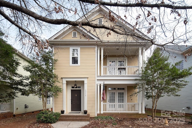 view of front of home featuring a balcony