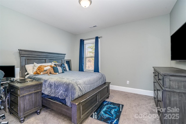 bedroom featuring light colored carpet, visible vents, and baseboards