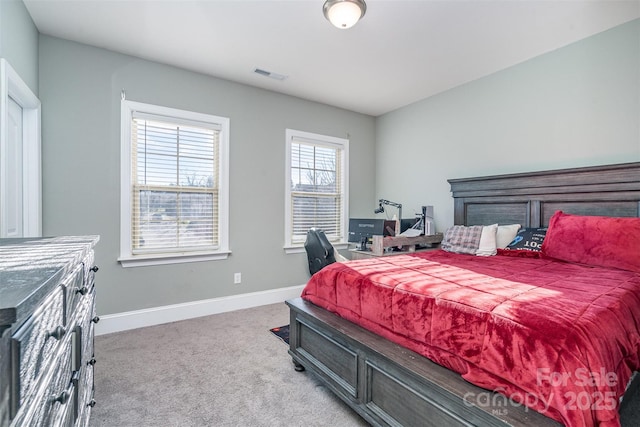 bedroom with carpet, visible vents, and baseboards