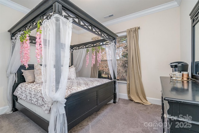 carpeted bedroom featuring ornamental molding, visible vents, and baseboards