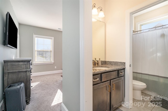 full bath featuring baseboards, vanity, and toilet