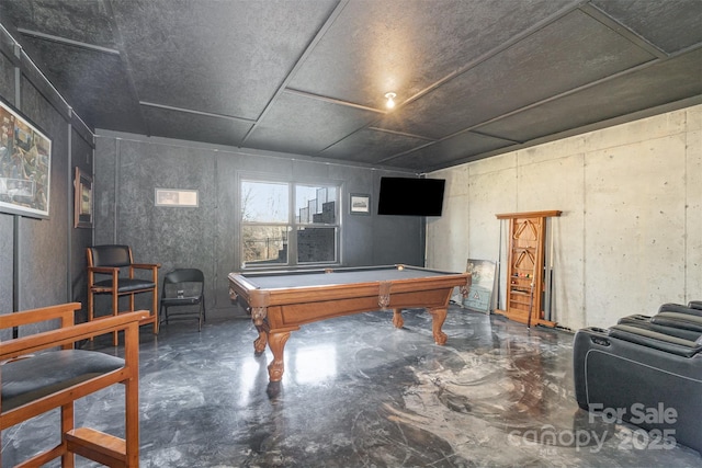 rec room with billiards and concrete flooring