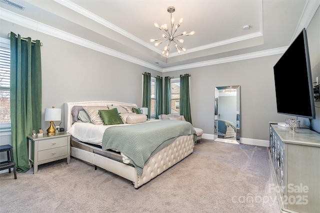 bedroom with light carpet, visible vents, a tray ceiling, crown molding, and a chandelier