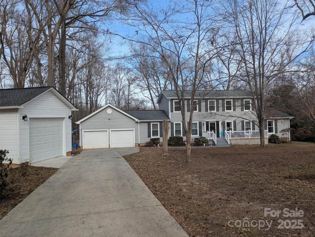 colonial house with a garage and a porch