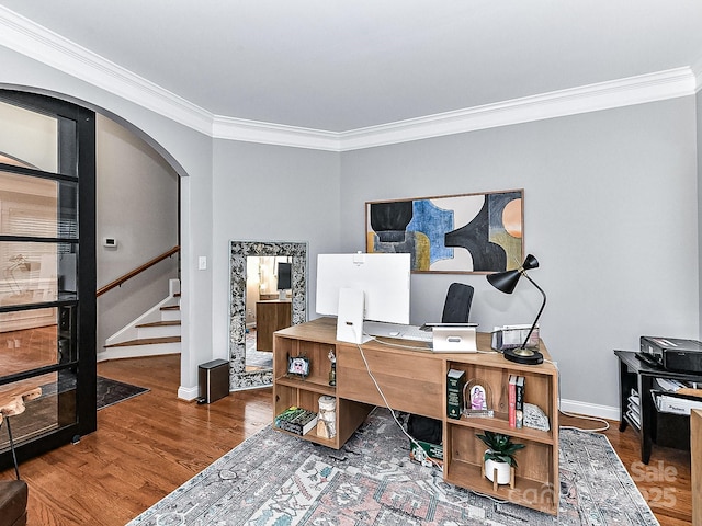 home office with hardwood / wood-style flooring and crown molding