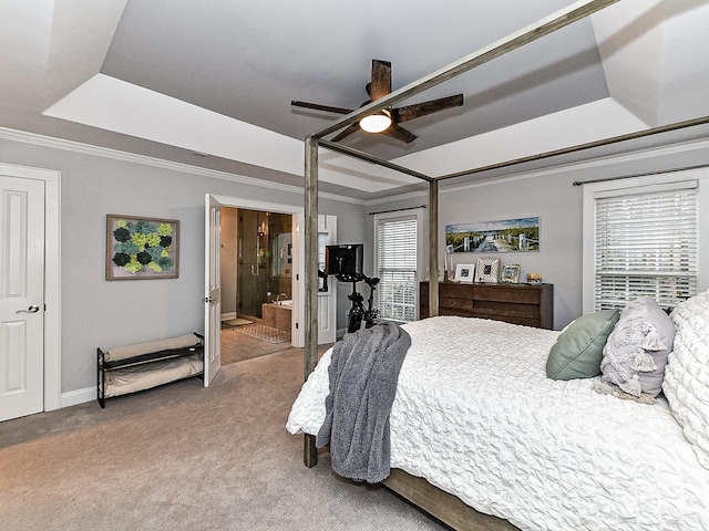 carpeted bedroom featuring crown molding, ceiling fan, a raised ceiling, and multiple windows