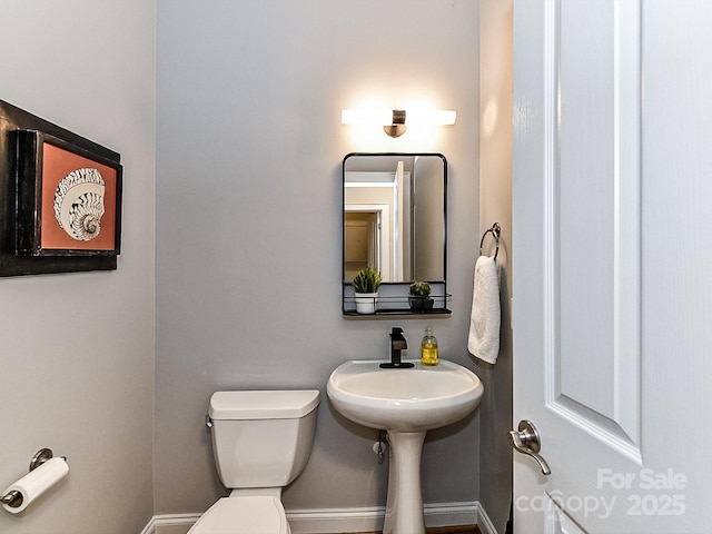 bathroom with toilet and sink