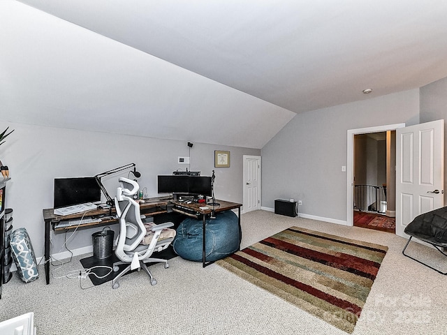 office with vaulted ceiling and carpet