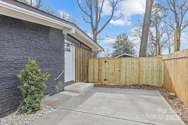 property entrance with a patio area