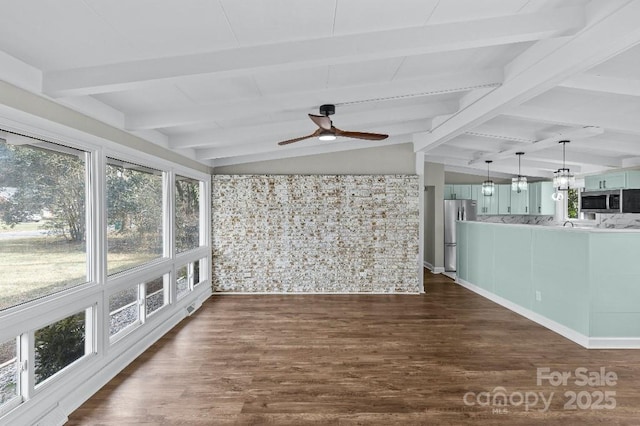 unfurnished sunroom with ceiling fan, a healthy amount of sunlight, and lofted ceiling with beams