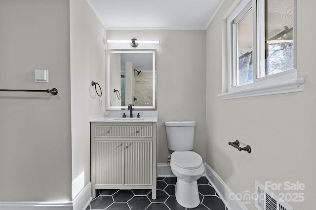 bathroom with walk in shower, tile patterned floors, toilet, and vanity