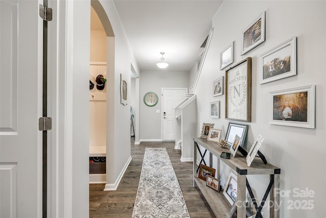 hallway with dark wood-type flooring