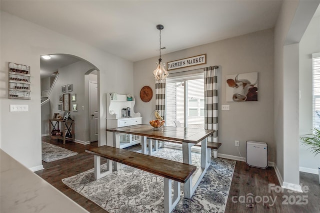 dining space featuring dark hardwood / wood-style flooring