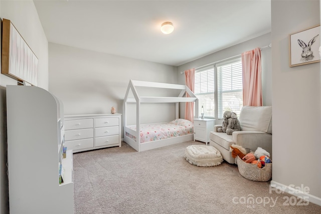 bedroom featuring light colored carpet