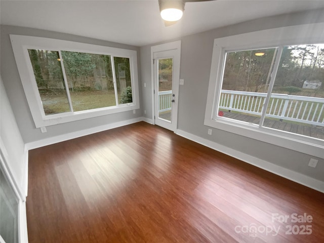 spare room featuring dark hardwood / wood-style flooring