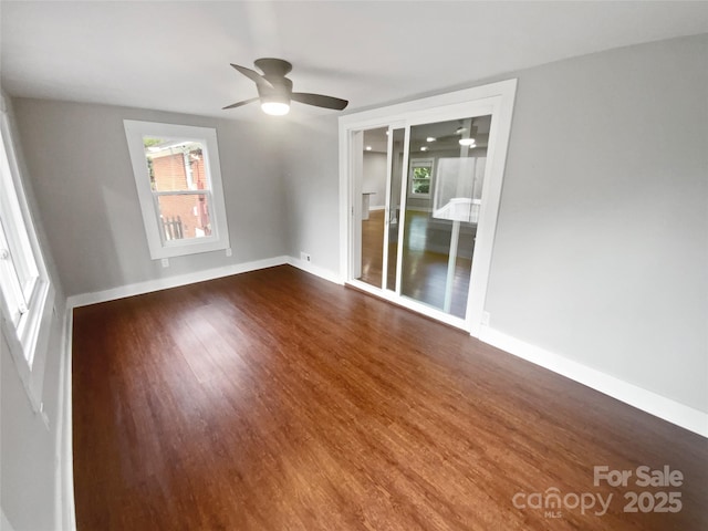 empty room featuring hardwood / wood-style flooring and ceiling fan