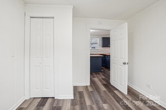 hall with dark hardwood / wood-style floors