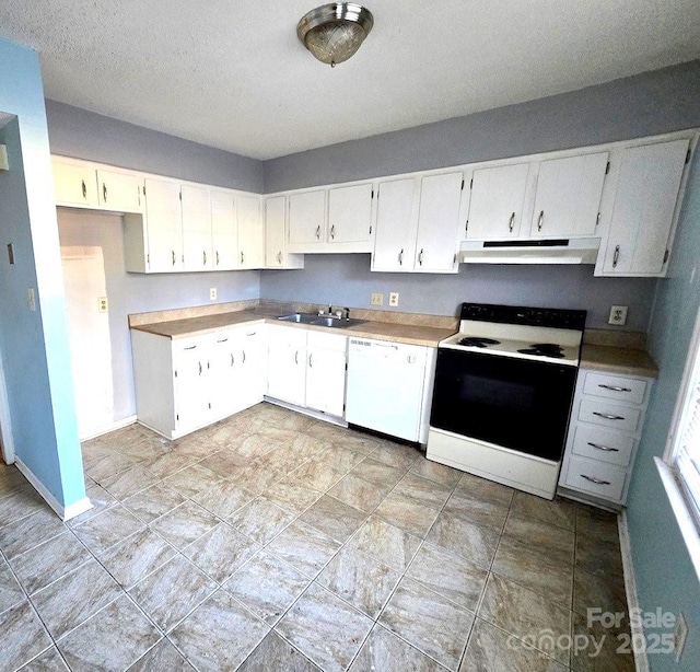 kitchen featuring white dishwasher, electric range oven, sink, and white cabinets