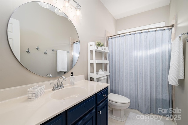 bathroom featuring vanity, a shower with shower curtain, toilet, and tile patterned flooring