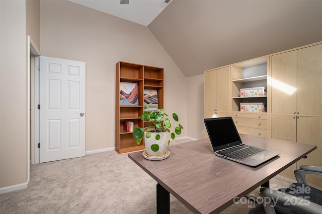 home office with light colored carpet, baseboards, and lofted ceiling