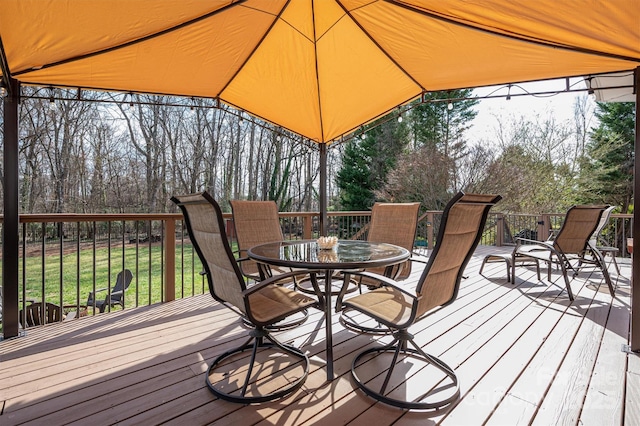 deck with outdoor dining area