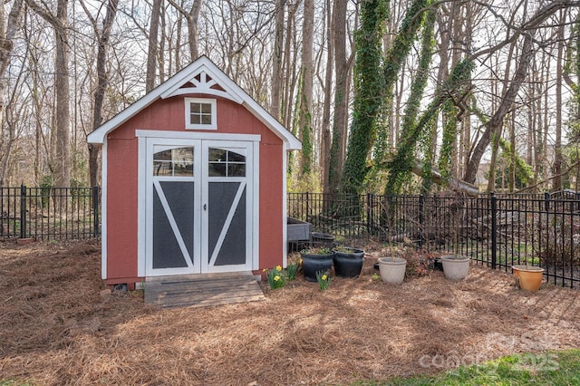 view of shed featuring a fenced backyard and entry steps