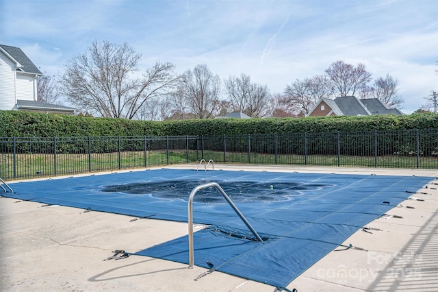 view of pool with a patio area, fence, and a fenced in pool