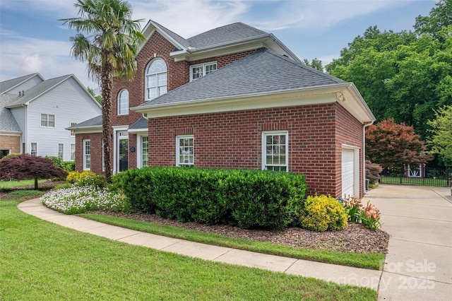 133 Castaway Trl, Mooresville, NC 28117 - view of front of home featuring driveway, brick siding, a garage, and roof with shingles