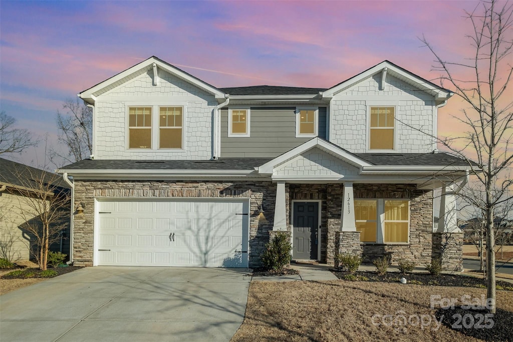 view of front of property with a garage