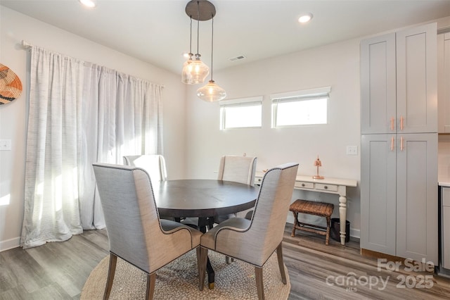 dining area featuring dark hardwood / wood-style floors