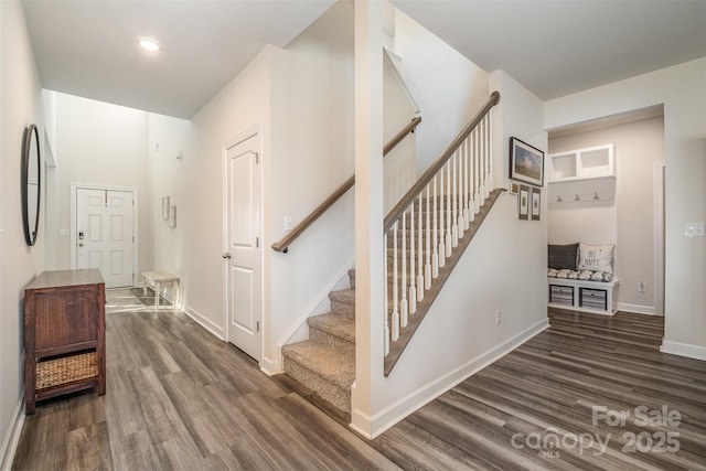 staircase with hardwood / wood-style flooring