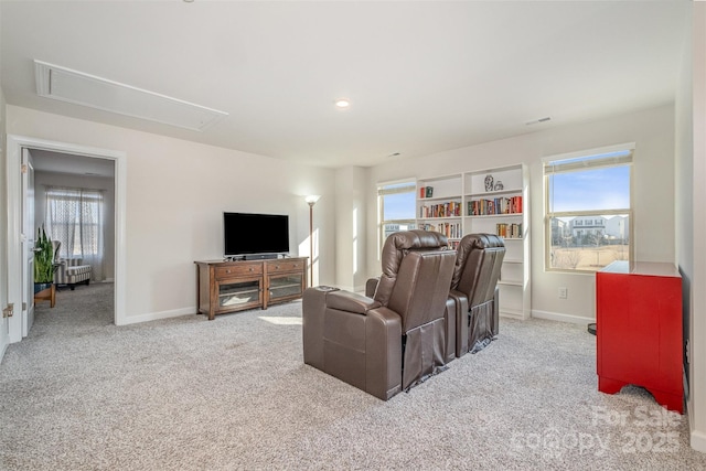 carpeted living room with built in features