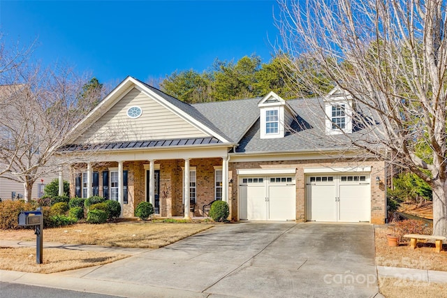 view of front of home with a garage and covered porch