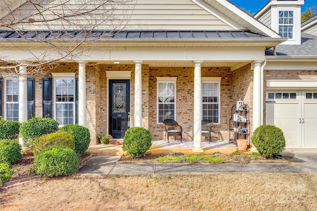 entrance to property featuring covered porch