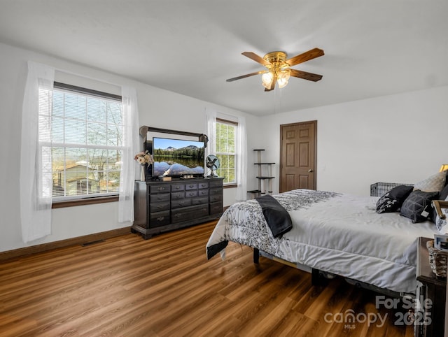 bedroom featuring ceiling fan and hardwood / wood-style floors